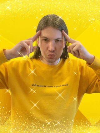 Kinda like that Coldplay song, "it's all yellow". Jim is wearing a yellow jumper and has been edited in front of a yellow background; it's kinda giving Minions.