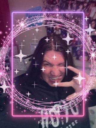 A selfie of Jim in the fbi studio that has been filtered and yassified to the nth degree and is covered in pink sparkles.
