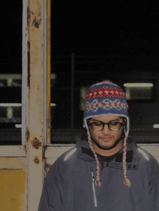 A portrait photograph of Arsonist.