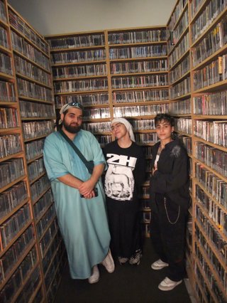 Mohammad, Sara and Aiysha stand in the music library looking strong but soft as a trio