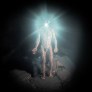 Marcus Whale, Naked and a little muddy, wearing a head torch, with the flash on, with a black background