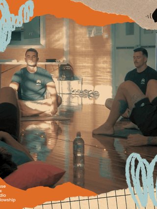 A group of guys sitting together on the floor taking a moment to stay calm and breathe