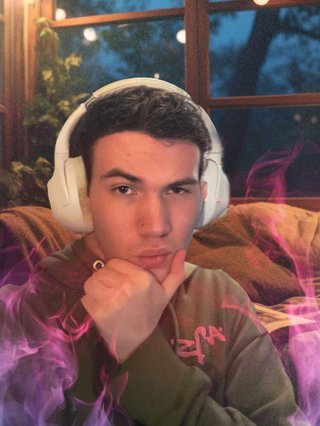 Jim edited to have a very masculine face. They are pulling a cringey "rizz face" pose in front of an edited-in lounge room background.