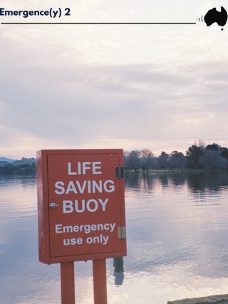 A calm lake on a cloudy afternoon with a life saving buggy cabinet