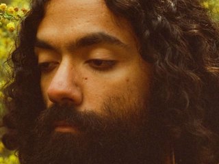 A close up grainy film photo of WAARI