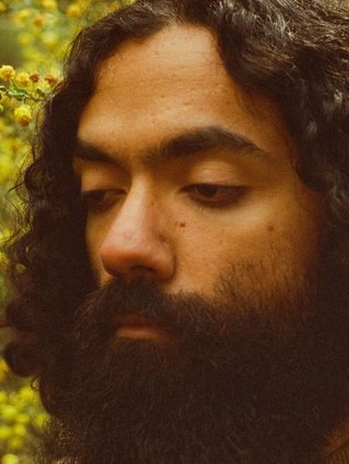 A close up grainy film photo of WAARI