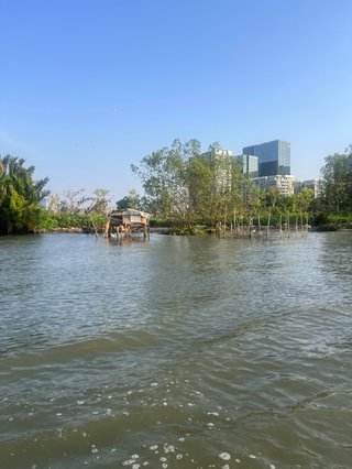 A boat shed on the water on a bright and sunny day