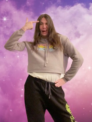 Jim edited in front of a galaxy background, pulling the "if you're feeling down look in the mirror and hit this pose" pose.