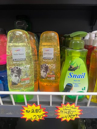 A photo of a store shelf in Vanuatu with colourful hair gel products