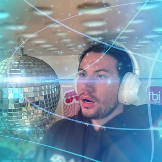 A highly edited photo of Jim staring in wonder at a disco ball.