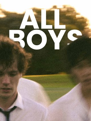 Six school boys standing in a field in low light. The image is blurred. The Words "All Boys" are in the background.