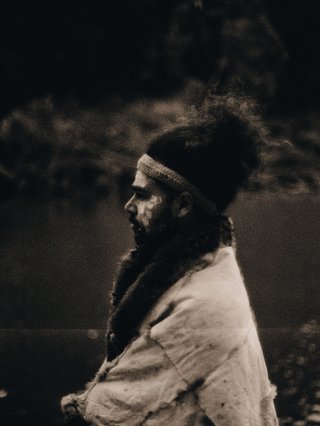 A black and white image of the artist DRMNGNNOW