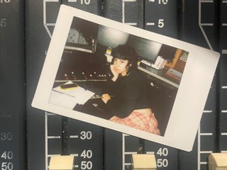 A polaroid of Ella Avni in the studio on top of the mixer which is also located in the studio.
