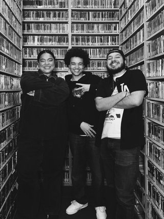 3 people posing silly in the music library