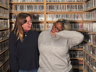 Ify and EBS posing in the music library