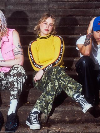 Fvneral are sitting on stone steps.