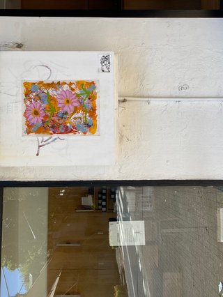 A painted array of mixed flowers on a electricity switchboard