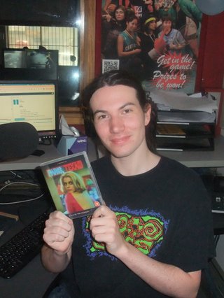 Jim Kretschmer is in the studio holding up a blu-ray disc of the movie Paris, Texas.