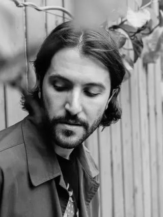 A black and white photo of Lance Gurisik