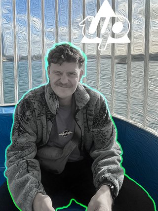 Harrie sits on a ferris wheel staring at the camera, his body is in black and white with a coloured outline (blue and green) the background is coloured. The Up logo is on his right side