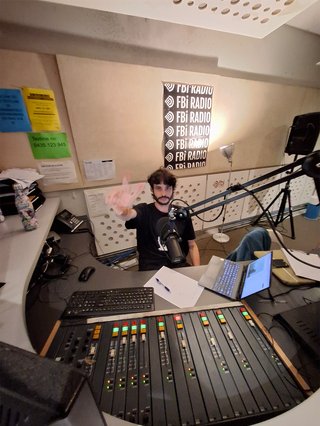 Jasper Craig Adams (far left) stands in the music library with NZ slowcore band SODA BOYZ