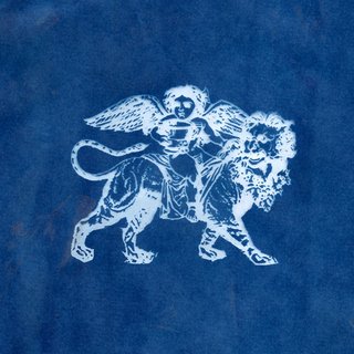 A white stamp of an angel sitting on a lion. The stamp is imprinted on a blue background