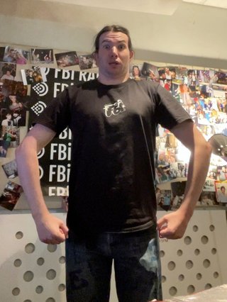 Jim in the fbi radio studio pulling an... odd pose.