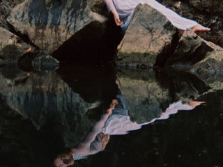 A reflected image of c_h_l__o_e looking down on a body of water