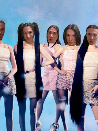A very poor photoshop of Jim's face five times onto each of the members of girl group ILLIT.