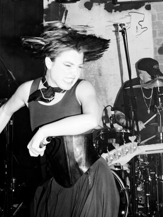 A black and white photo of Gut Health playing live.